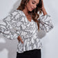 Ruched Printed V-Neck Long Sleeve Blouse